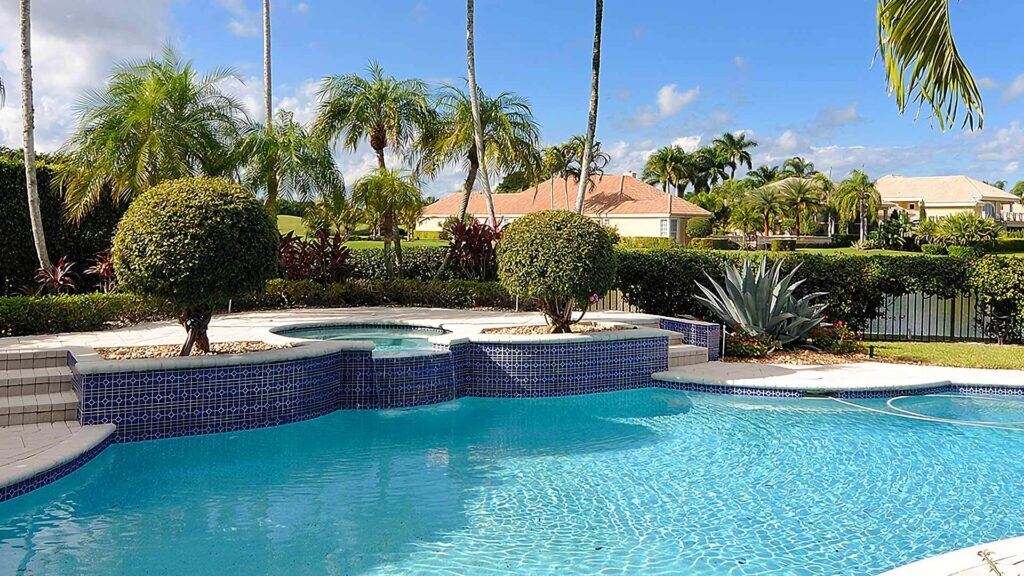 A South Florida home with a screened pool and covered patio